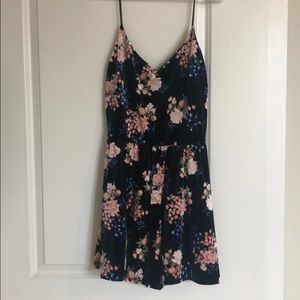 Black velvet romper with floral print